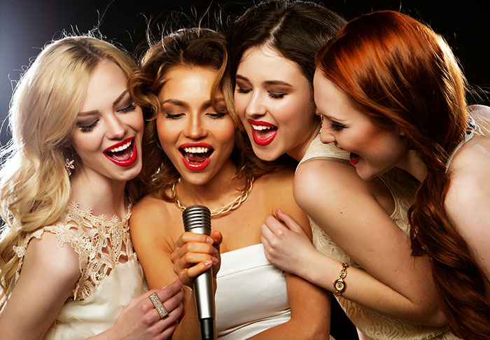 Ladies-learning-how-to-sing-in-a-group-format