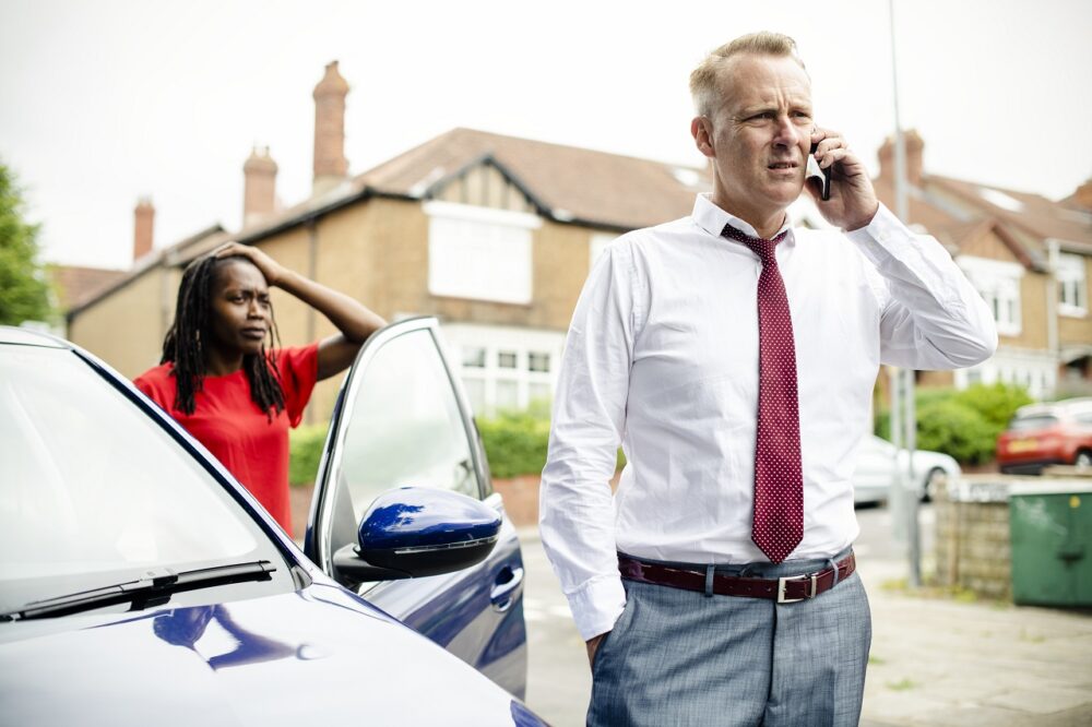 Man calling an insurance after a car accident