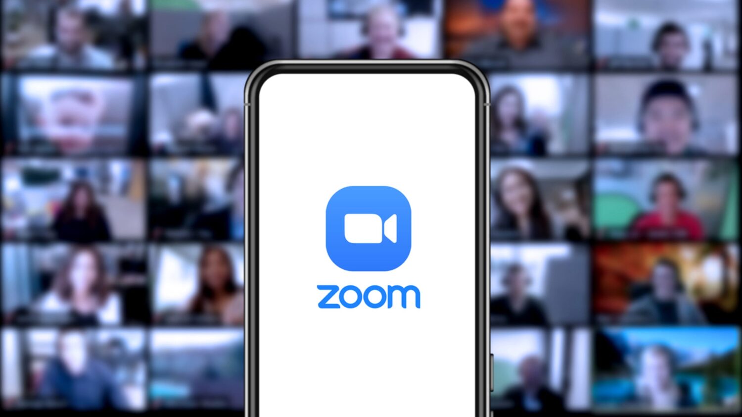 Zoom-logo-on-a-smartphone-with-a-video-call-in-the-background