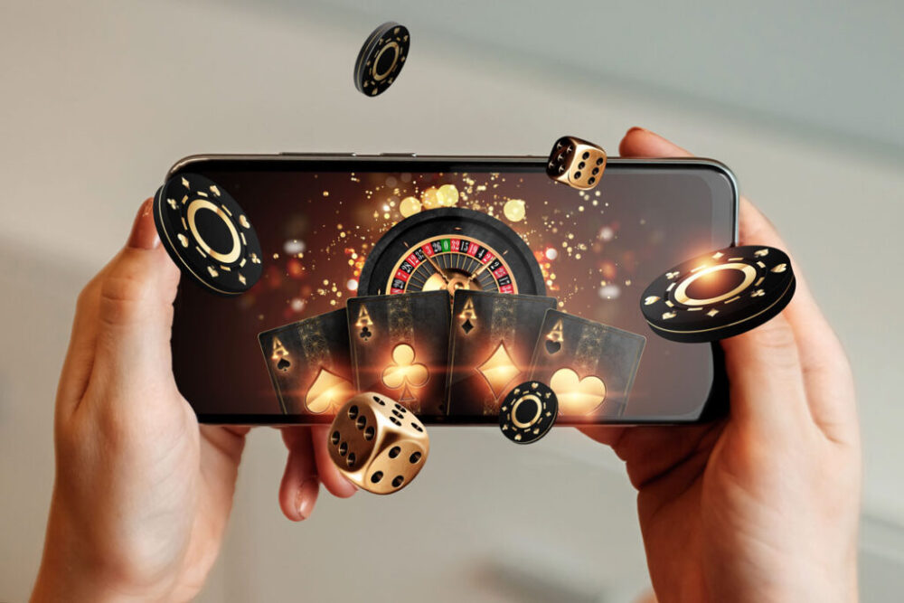 Creative,Background,,Online,Casino,,In,A,Man’s,Hand,A,Smartphone