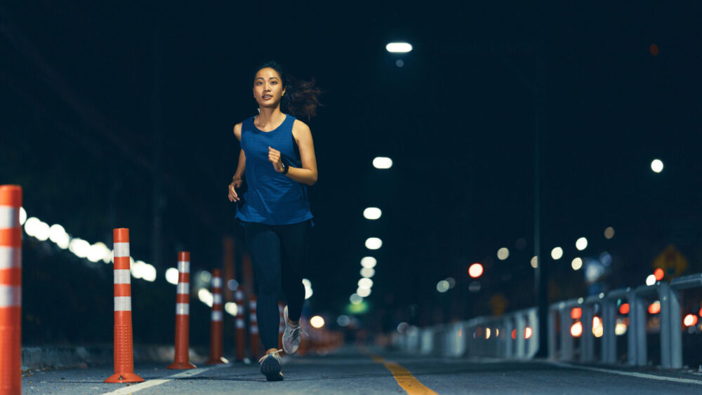 Asian,Woman,Practicing,Running,At,Night