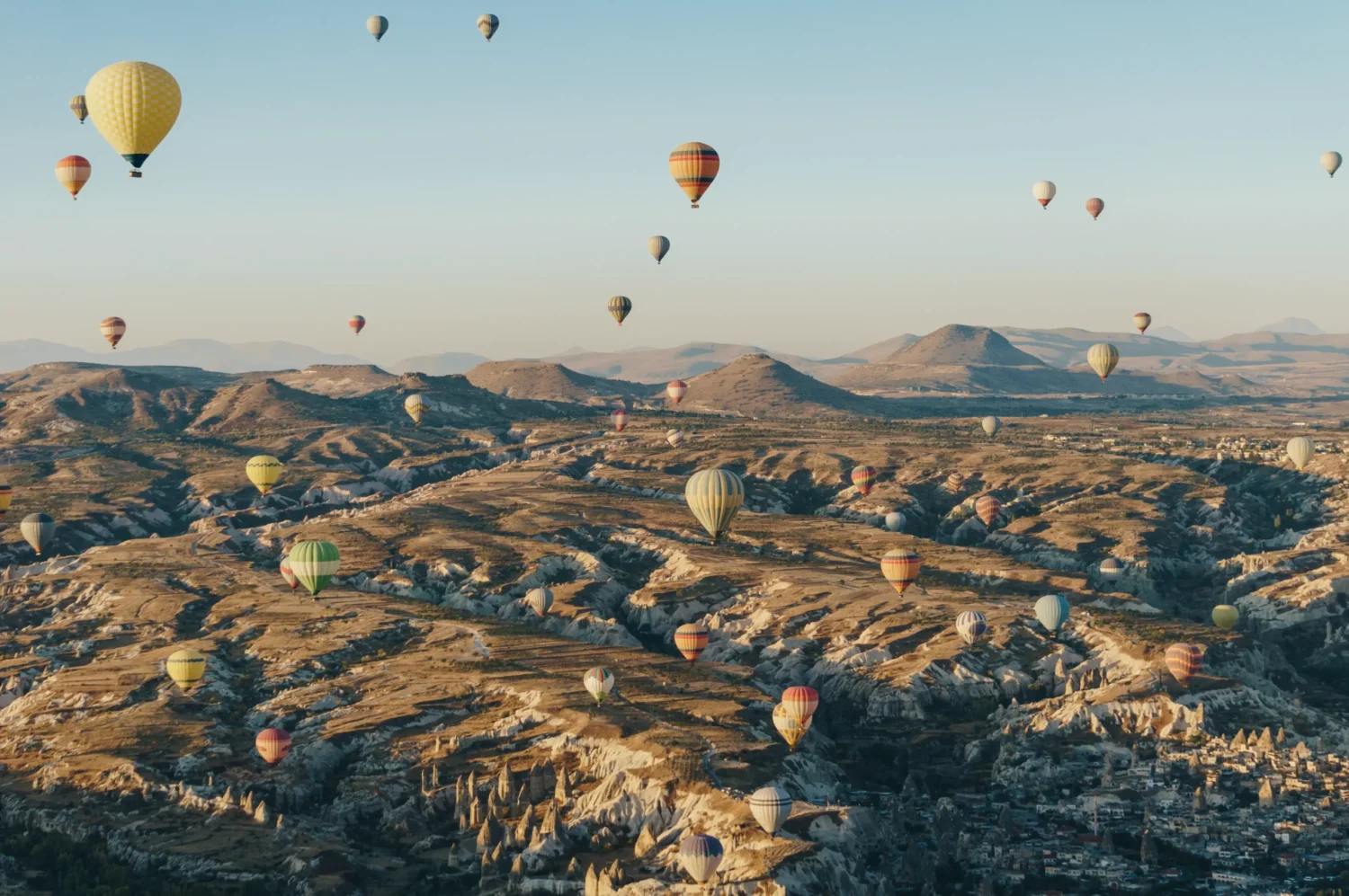 mountain-landscape-with-hot-air-balloons-cappadoc-2022-11-02-03-49-38-utc-scaled