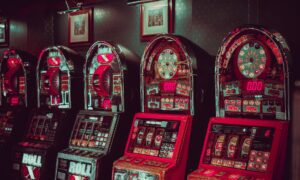 Image alt tag: A colorful slot machine with buttons and a digital display, offering a thrilling gambling experience.