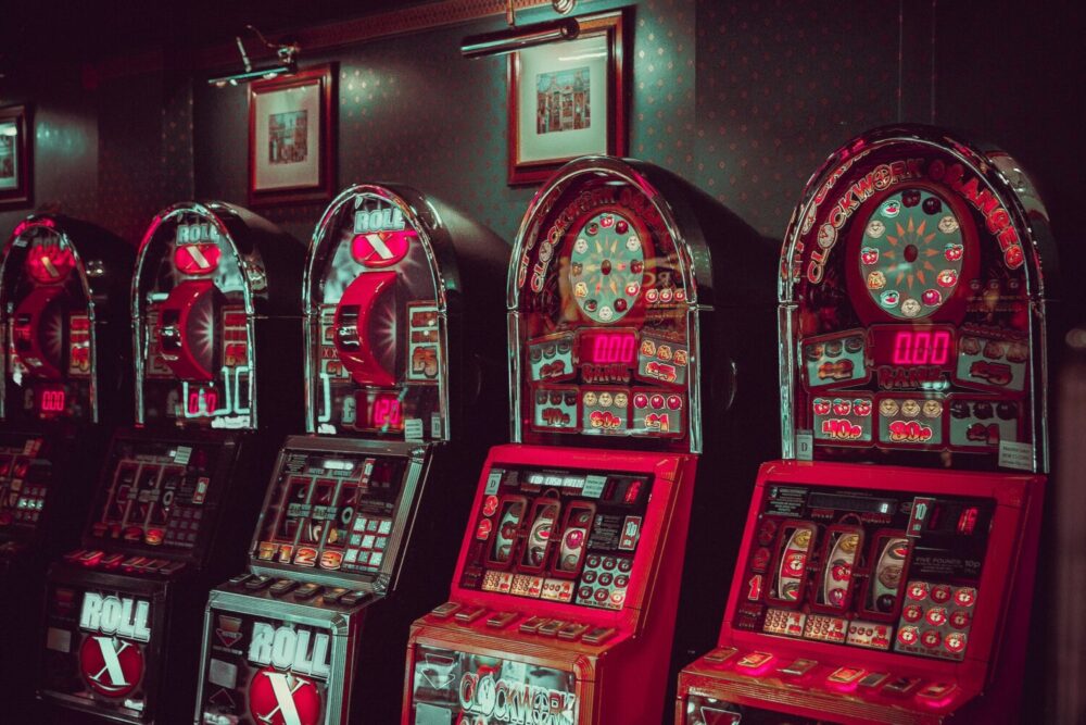 Image alt tag: A colorful slot machine with buttons and a digital display, offering a thrilling gambling experience.